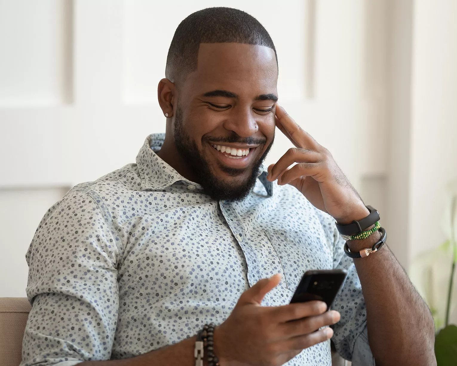 man reading news on phone