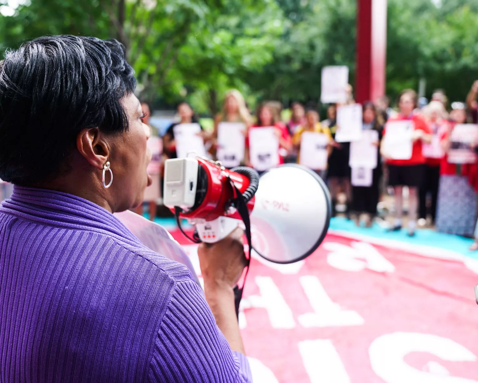 Becky Pringle at an immigration rally with a bullhorn