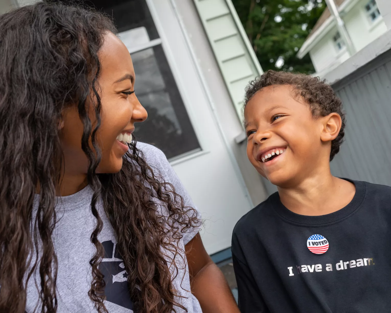 Parent and child looking at each other and smiling